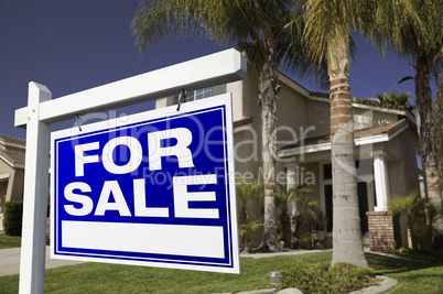 For Sale Real Estate Sign and House