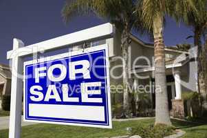 For Sale Real Estate Sign and House
