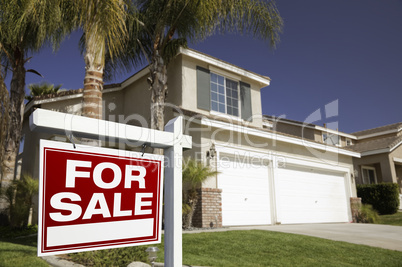 Red For Sale Real Estate Sign and House