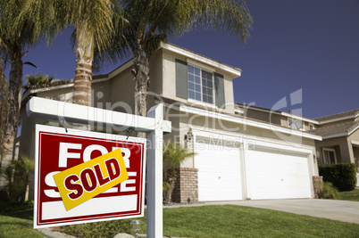 Red Sold For Sale Real Estate Sign and House