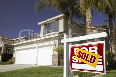 Red Sold For Sale Real Estate Sign and House