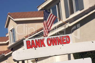 Bank Owned Real Estate Sign and House with American Flag