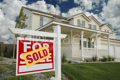 Sold Home For Sale Sign and House