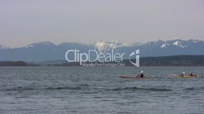 Kayaking In Front Of Mountains