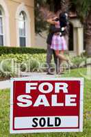 African American Couple Celebrating House Purchase Behind For Sa