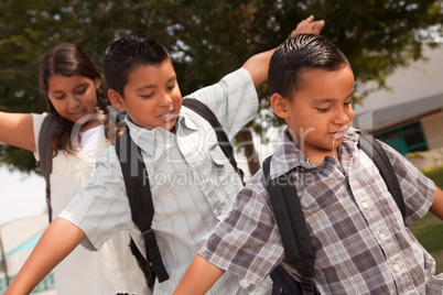 Cute Brothers and Sister Having Fun Walking to School