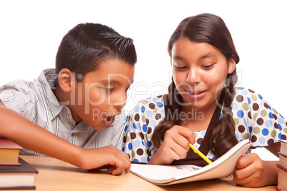 Hispanic Brother and Sister Having Fun Studying