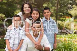 Happy Hispanic Family In the Park