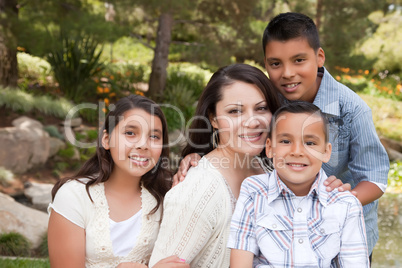 Happy Mother and Children in the Park