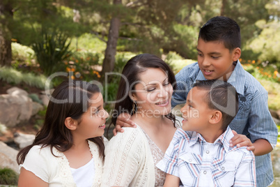 Happy Mother and Children in the Park