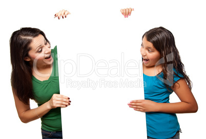 Pretty Hispanic Girl and Mother Holding Blank Board