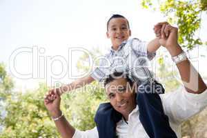 Hispanic Father and Son Having Fun in the Park