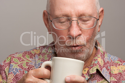 Senior Man Enjoys His Coffee