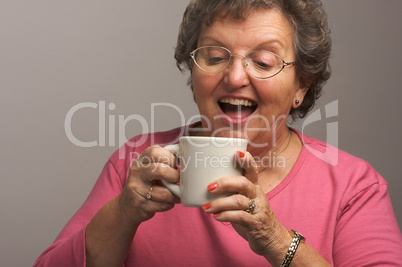 Senior Woman Enjoys Her Coffee