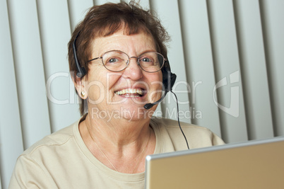Smiling Senior Adult with Telephone Headset