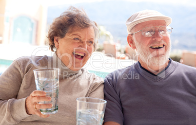 Happy Senior Adult Couple with Drinks