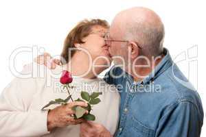 Happy Senior Couple Kissing with Red Rose