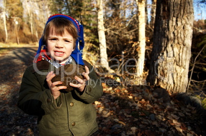 Boy holding rock