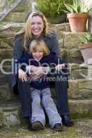 Mother & Son In The Garden