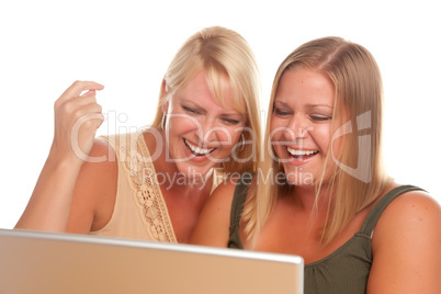 Two Laughing Women Using Laptop
