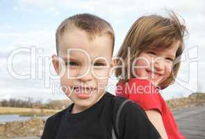 Two Children Smile for the Camera