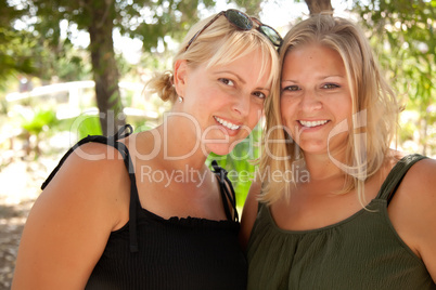 Two Beautiful Smiling Sisters Ourdoor Portrait