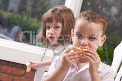 Sister and Brother Eating an Apple