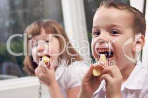 Sister and Brother Eating an Apple