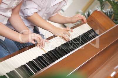 Children Playing the Piano