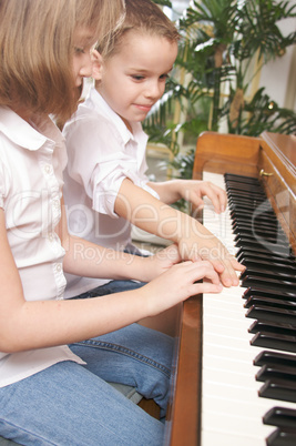 Children Playing the Piano