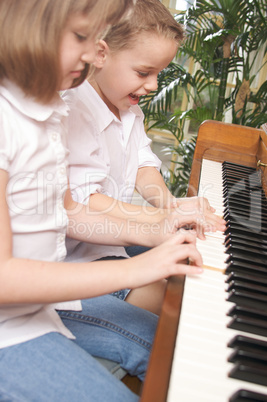 Children Playing the Piano