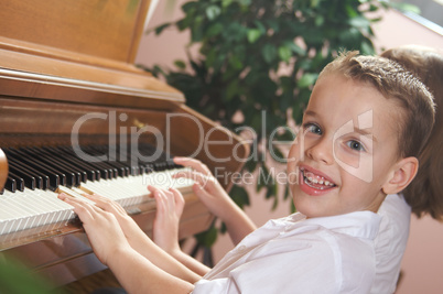 Children Playing the Piano