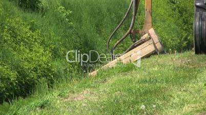 Tractor Cutting Grass In Ditch - Close Up