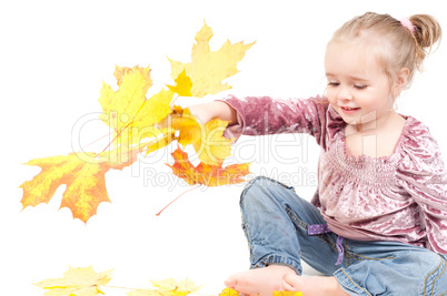 Toddler with maple leaves