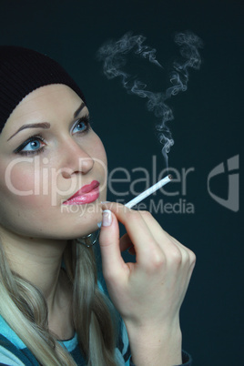 beautiful blonde keeps cigarette