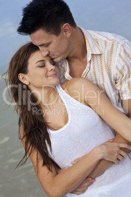 Man and Woman Couple In Romantic Embrace On A Beach