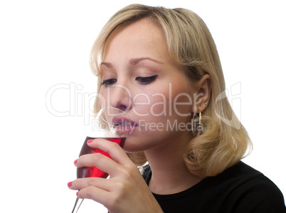 The girl drinks wine.