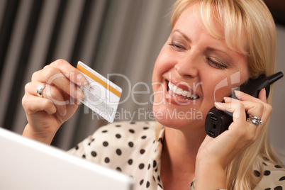 Beautiful Woman on Phone Holding Credit Card