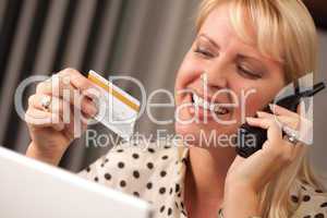 Beautiful Woman on Phone Holding Credit Card