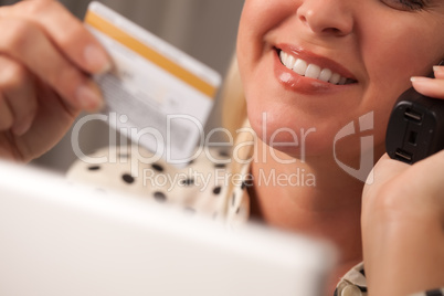 Beautiful Woman on Phone Holding Credit Card