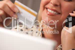 Beautiful Woman on Phone Holding Credit Card