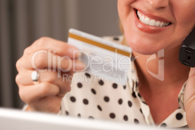 Beautiful Woman on Phone Holding Credit Card