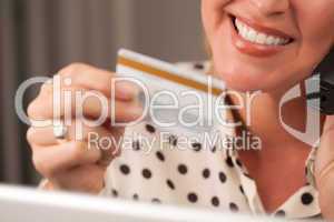 Beautiful Woman on Phone Holding Credit Card