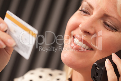 Beautiful Woman on Phone Holding Credit Card