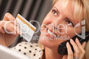 Beautiful Woman on Phone Holding Credit Card