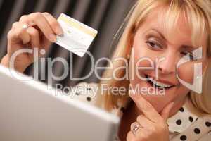 Beautiful Woman Using Laptop Holding Her Credit Card