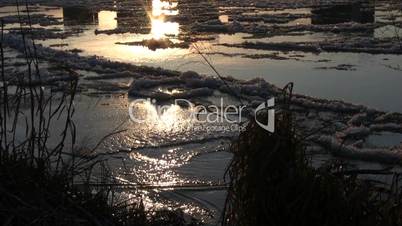 Ice drift in a river at sunset 9