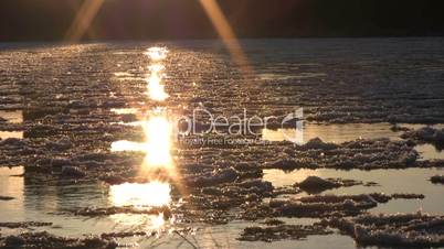 Ice drift in a river at sunset 13