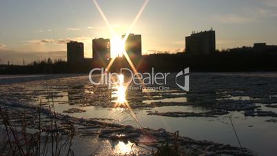 Ice drift in a river at sunset 14