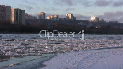 Ice drift in a river at sunset 15